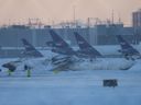 The site of the snow-covered Delta Airline plane crash at Toronto Pearson International Airport on Feb. 18, 2025, the morning after the crash.