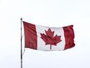 A Canadian flag blows in the wind, Wednesday February 12, 2025.