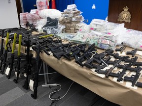 RCMP display guns, drugs and money seized from a fentanyl
