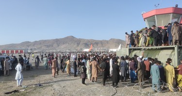 The desperate scene at Kabul International Airport on Aug. 16, 2021, as thousands of Afghans try to get out of the country.