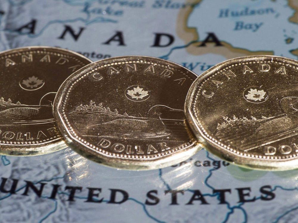 NextImg:Loonie falls after sweeping tariffs announced by Trump