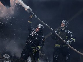 Firefighters put out a fire