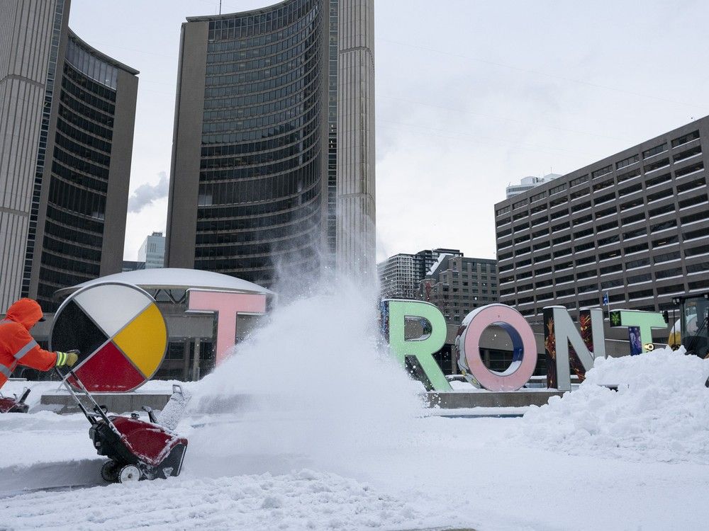 NextImg:It could take 3 weeks to clear snow dump from Toronto streets, city officials say