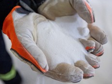 Potash is held in gloved hands