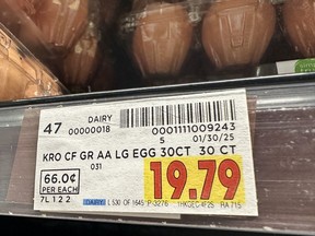 A price sticker for eggs on a shelf