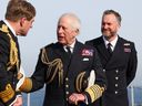 A handout photo received from Britain's Ministry Of Defence (MOD) shows Britain's King Charles III during his visit to the Royal Navy aircraft carrier HMS Prince of Wales, in the English Channel, on March 4, 2025.