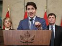 Canada's Prime Minister Justin Trudeau speaks during a news conference about the US tariffs against Canada on March 4, 2025 on Parliament Hill in Ottawa, as (L-R) Foreign Minister Melanie Joly, Minister of Finance and Intergovernmental Affairs Dominic Leblanc and Minister of Public Safety David McGuinty look on. Trudeau said that President Donald Trump imposed tariffs on Canada to destroy the country's economy to make it easier for the United States to annex its northern neighbor. (Photo by Dave Chan / AFP)
