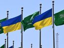 Flags of Saudi Arabia and Ukraine line the King Abdulaziz Road in the Saudi Red Sea port city of Jeddah ahead of a visit by the Ukrainian President on March 10, 2025. Ukraine's President Volodymyr Zelensky is due to arrive in Saudi Arabia on March 10, a day ahead of crucial talks between Ukrainian and U.S. officials on ending the war with Russia.