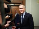 Liberal Leader Mark Carney talks to media as he leaves the prime minister's office and makes his way to a caucus meeting in Ottawa, Monday, March 10, 2025. THE CANADIAN PRESS/Sean Kilpatrick