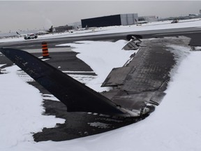 A detached, burned airplane wing.
