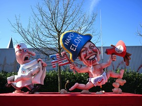Elon Musk depicted on a parade float.