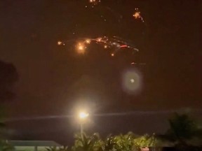 Exploded rocket debris in the night sky.