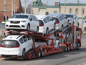 A car carrier loaded with cars.