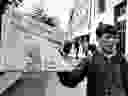 A newsboy holds up a newspaper with a banner headline reporting the invoking of the War Measures Act, in Ottawa,  Oct. 16, 1970 the first time Canada had invoked the act in peacetime.  The act was put into effect following the kidnapping of British diplomat James Cross and Quebec Labour Minister Pierre Laporte by the terrorist FLQ.