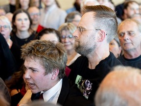 A heckler is escorted out