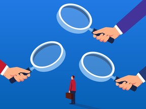 Businessman under the magnifying glass