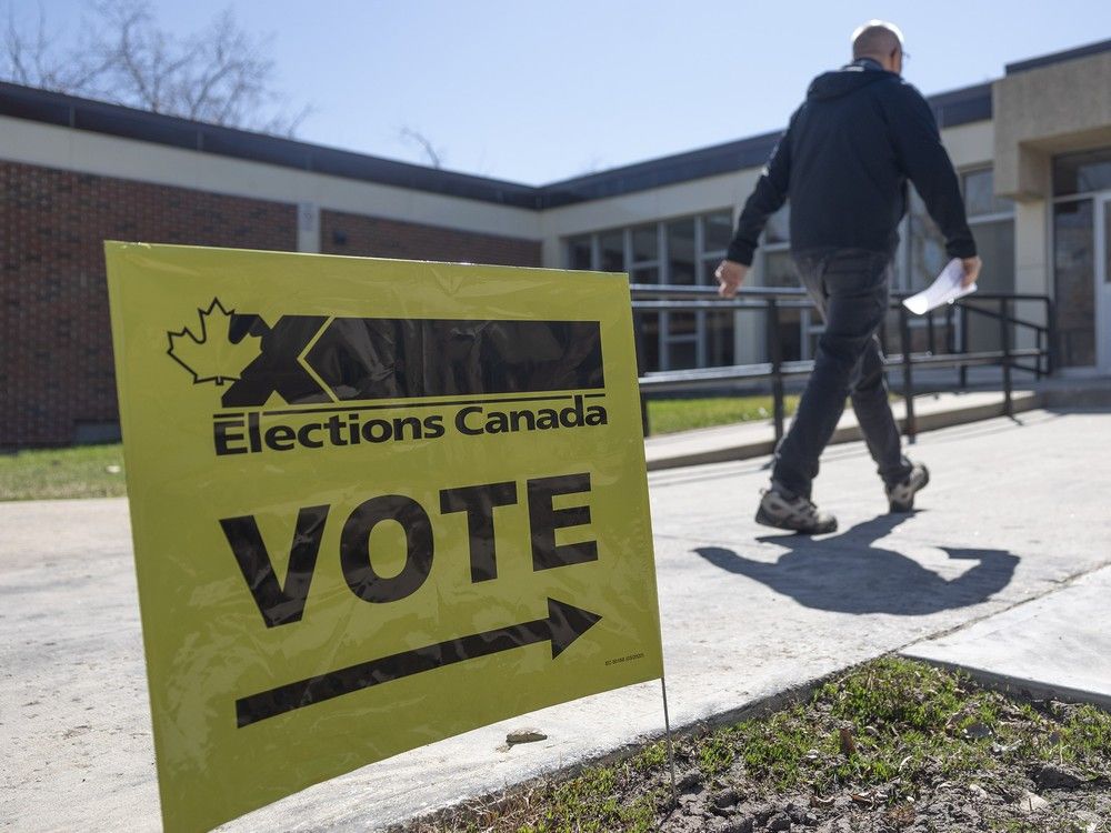  A voter walks into Balfour Collegiate in Regina, Sask., to cast their ballot on Monday.
