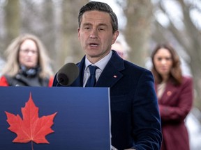 Conservative Leader Pierre Poilievre speaks into a microhone at a podium outside