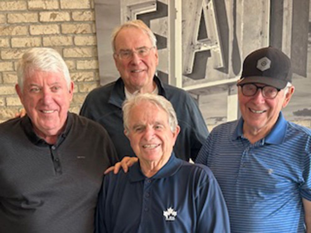  Bob McGuinn, left, and Ken Dryden, back, with John O’Flaherty, middle front, and Jim Donaldson.