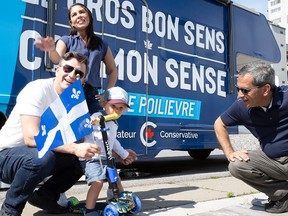 Pierre Poilievre with his wife and son, and Pierre Paul-Hus.