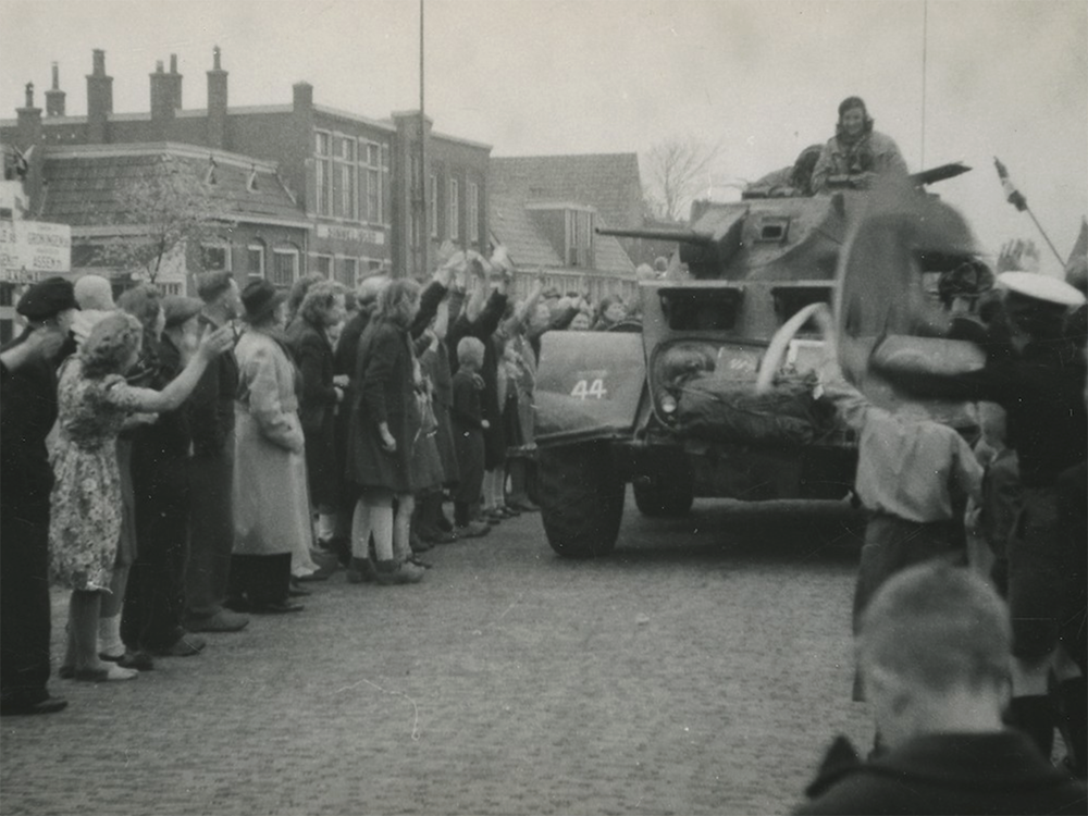  Leeuwarden residents celebrate as Dragoons roll through the liberated city in 1945.