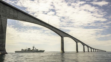 HMCS VILLE DE QUEBEC sails under the Confederation Bridge between New Brunswick and Prince Edward Island on May 17, 2020.