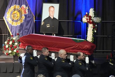 Pallbearers carry the casket of OPP Const. Grzegorz (Greg) Pierzchala after his funeral service in Barrie on Jan. 4.