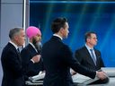 Bloc Québécois Leader Yves-François Blanchet, NDP Leader Jagmeet Singh and Conservative Leader Pierre Poilievre appear to be amused as Liberal Leader Mark Carney speaks during the English-language leaders' debate in Montreal on Thursday, April 17, 2025.