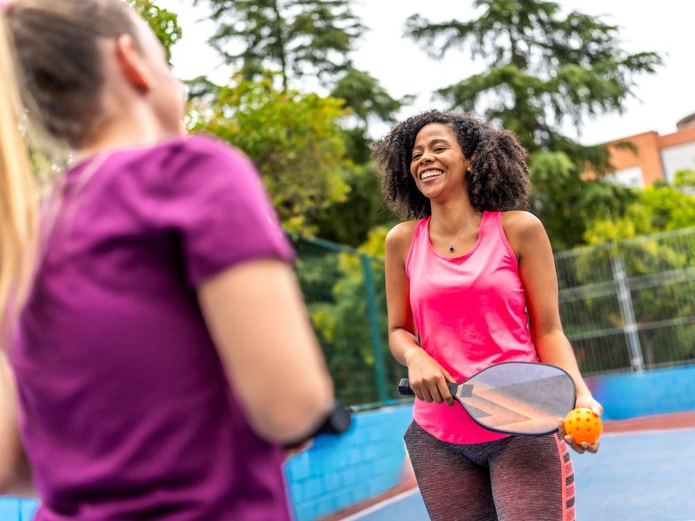  Friends playing pickleball. According to UBC research, time spent on sports and exercise has been positively associated with having a “good day” up until approximately five hours. Getty Images