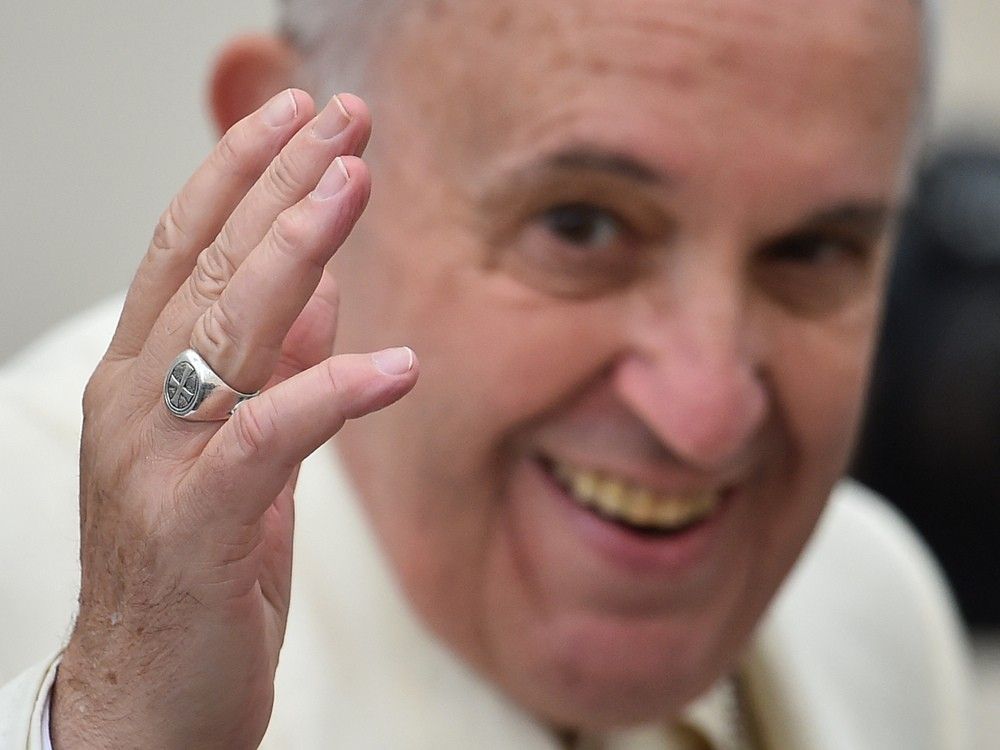  A close up shows the simpler silver ring of Pope Francis as he greets the crowd at the end of his weekly general audience on Dec. 3, 2014 at St Peter’s square in the Vatican.