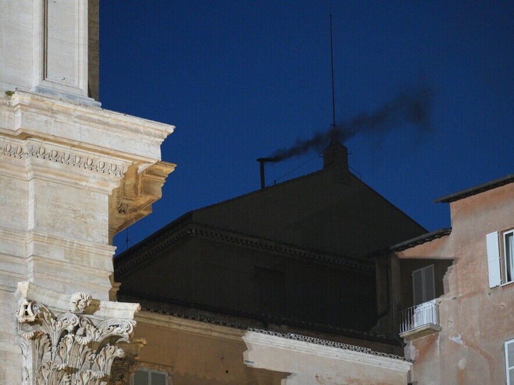 Black smoke is seen from the chimney of the Sistine Chapel meaning a new pope is not yet elected and voting will continue on May 7, 2025 in Vatican City. Black smoke is seen from the chimney of the Sistine Chapel meaning a new pope is not yet elected and voting will continue on May 7, 2025 in Vatican City.