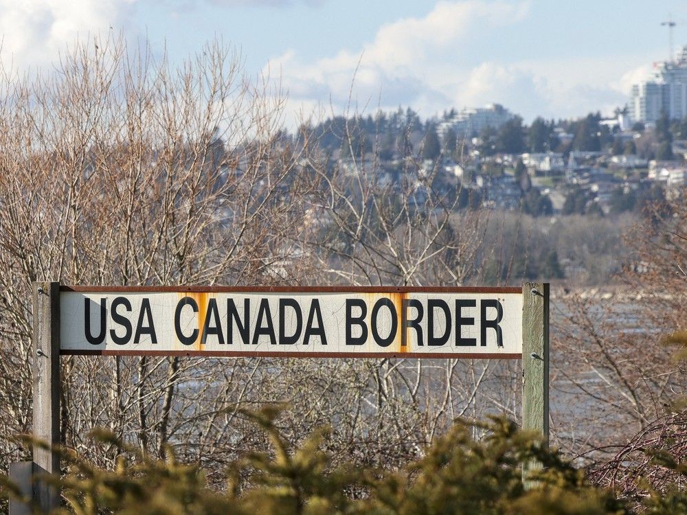 A sign for the US-Canada border is pictured at the Peace Arch border crossing in Blaine, Washington, on March 5, 2025. 