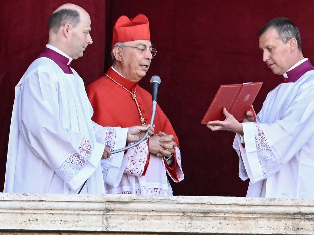  French cardinal proto-deacon Dominique Mamberti arrives to announce the name of the new pope from the main central loggia balcony of the St Peter’s Basilica, after the cardinals successfully ended the conclave voting, in The Vatican, on May 8, 2025.