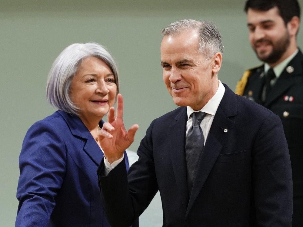 Gov. Gen. Mary Simon, left, will join Prime Minister Mark Carney waves after being sworn in as he names his new cabinet on May 12 at Rideau Hall in Ottawa. Gov. Gen. Mary Simon, left, will join Prime Minister Mark Carney waves after being sworn in as he names his new cabinet on May 12 at Rideau Hall in Ottawa.