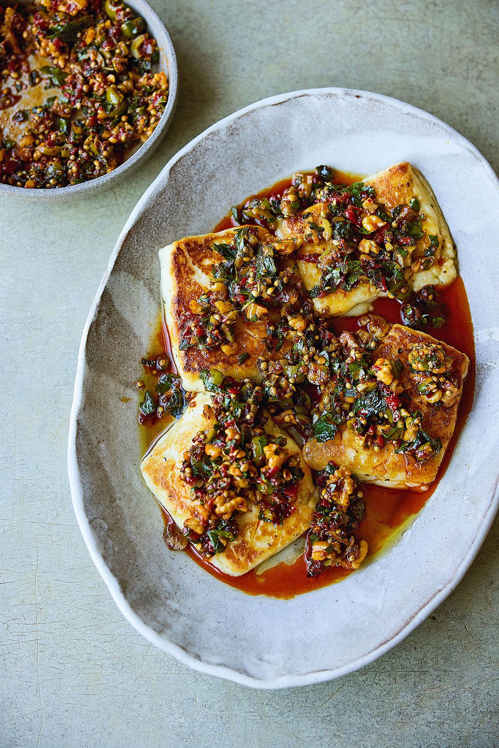  Enjoy Noor Murad’s halloumi with spicy olives and walnuts for brunch, lunch or dinner. To make it vegan, she suggests swapping the cheese for fried and salted tofu.