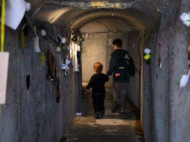 Children walk through the tunnel installation at Hostages Square in Tel Aviv on Jan. 25, 2025.
