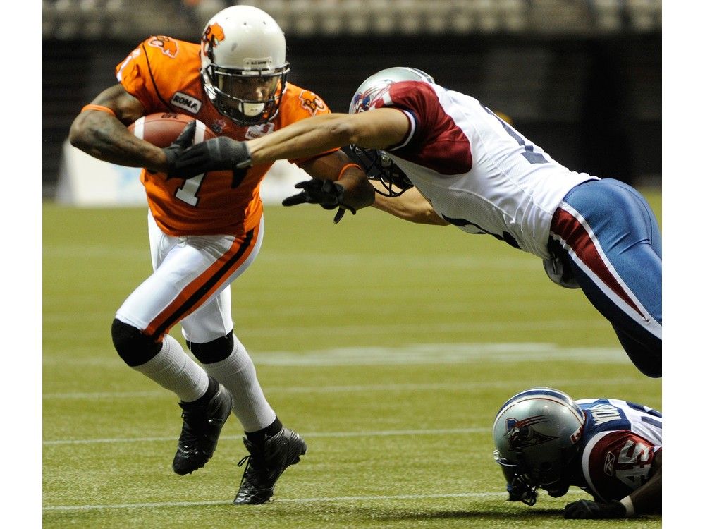 In this November 2011 photo, then BC Lions Arland Bruce III, left, eludes Montreal Alouettes players during a game at BC Place Stadium in Vancouver. In this November 2011 photo, then BC Lions Arland Bruce III, left, eludes Montreal Alouettes players during a game at BC Place Stadium in Vancouver.