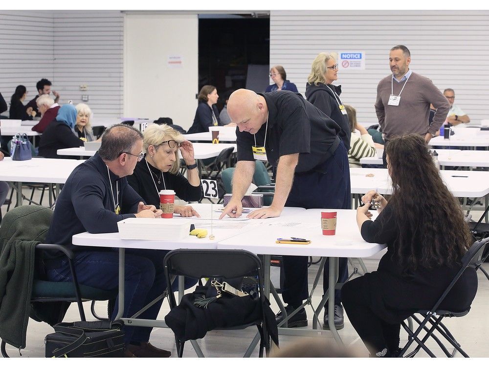 Elections Canada staff and Liberal and Conservative scrutineers are shown at the returning office in Tecumseh on Wednesday, May 21, 2025 where a ballot recount is underway for the federal riding of Windsor-Tecumseh-Lakeshore. Elections Canada staff and Liberal and Conservative scrutineers are shown at the returning office in Tecumseh on Wednesday, May 21, 2025 where a ballot recount is underway for the federal riding of Windsor-Tecumseh-Lakeshore.