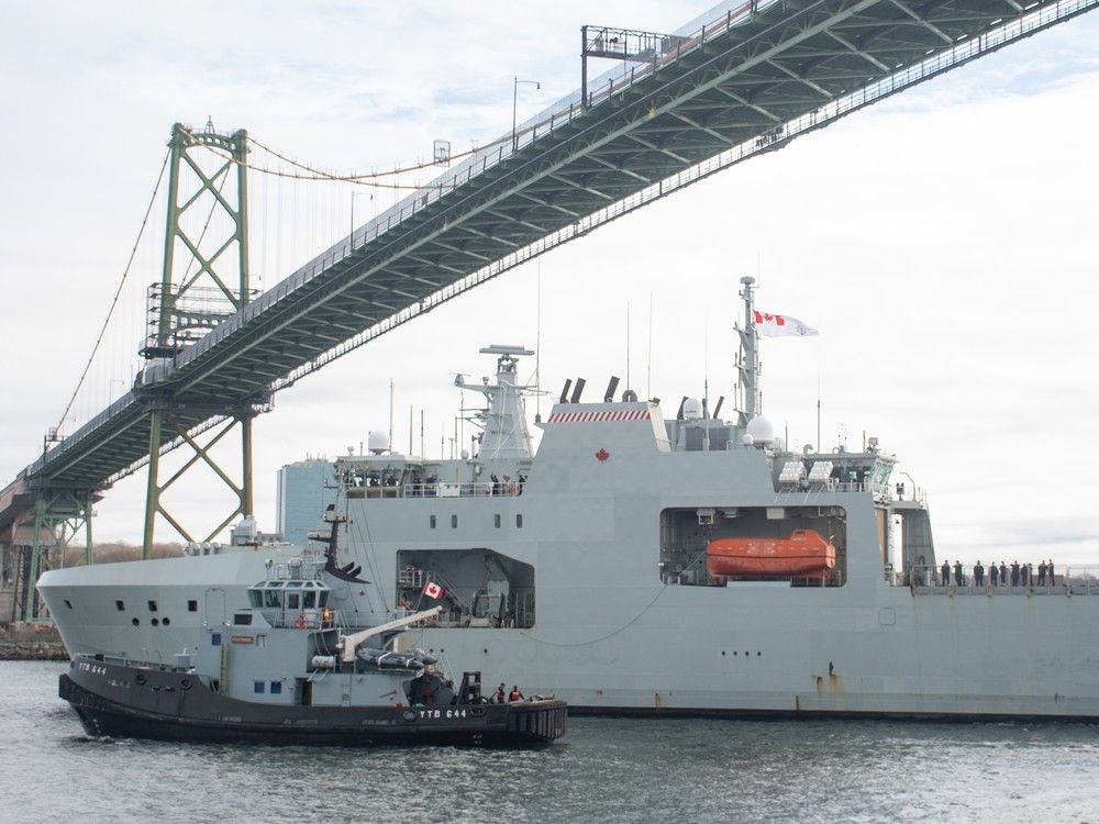  HMCS Margaret Brooke passes under the MacKay Bridge as it arrives back in Halifax on Friday, May 9, 2025.