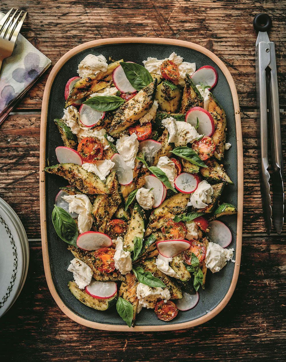  Grilled zucchini is “the perfect vegetable addition to any summer meal,” says Andrea Buckett. Here, she pairs it with mozzarella and pesto for a satisfying salad.