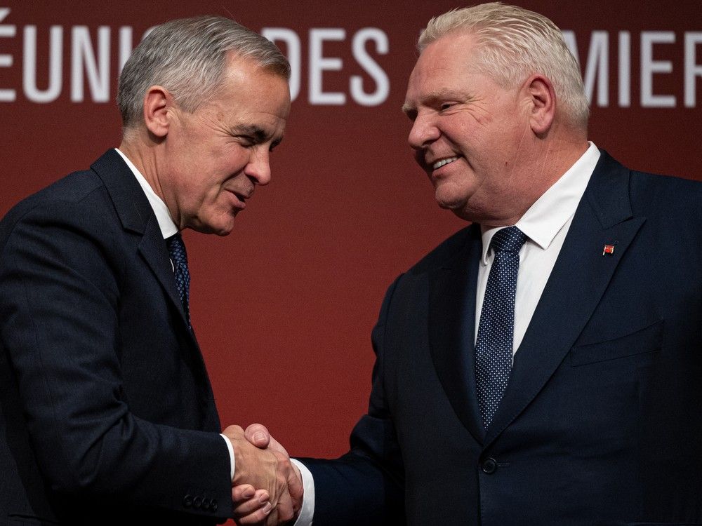 Prime Minister Mark Carney shakes hands with Ontario Premier Doug Ford during the first ministers’ meeting at TCU Place. Prime Minister Mark Carney shakes hands with Ontario Premier Doug Ford during the first ministers’ meeting at TCU Place.