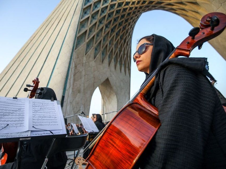 Members of the Tehran Symphony Orchestra perform under the capital's landmark Azadi Tower (Freedom Tower) on June 25, 2025, following a ceasefire between Israel and Iran. Members of the Tehran Symphony Orchestra perform under the capital's landmark Azadi Tower (Freedom Tower) on June 25, 2025, following a ceasefire between Israel and Iran.