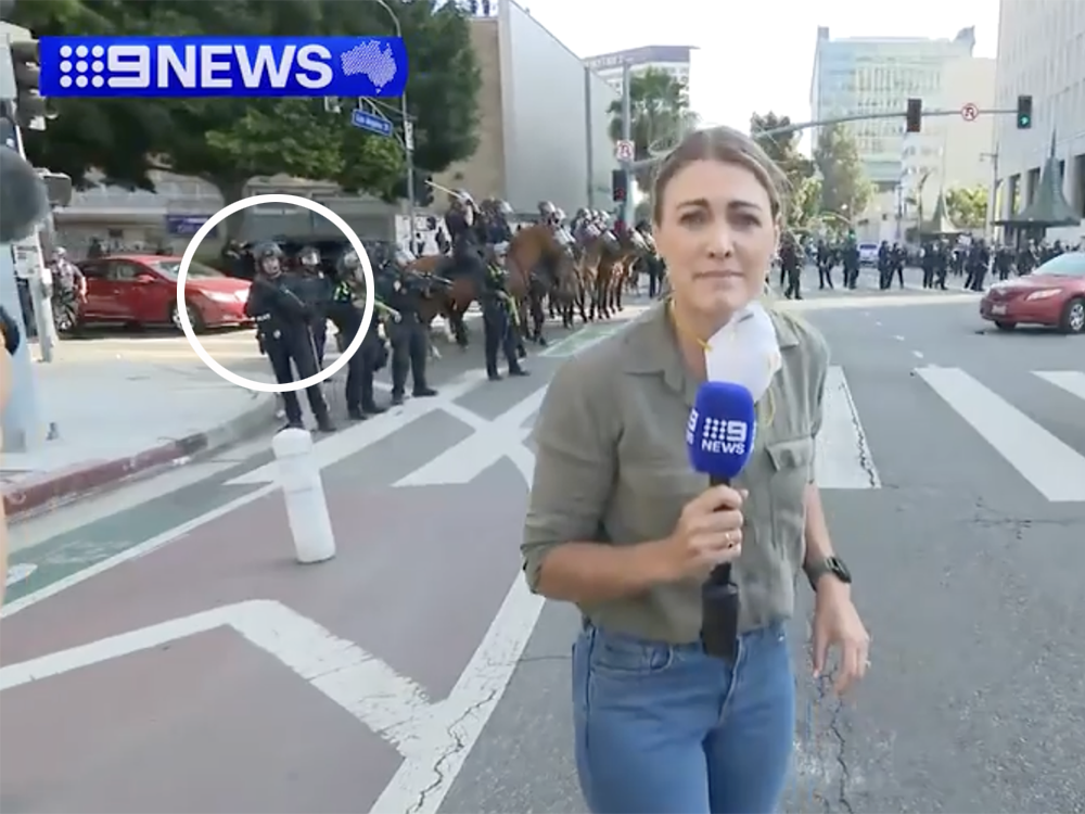 9News reporter Lauren Tomasi was hit by a rubber bullet fired by the LAPD at the far left while she was covering the protests in Los Angeles on Sunday. 9News reporter Lauren Tomasi was hit by a rubber bullet fired by the LAPD at the far left while she was covering the protests in Los Angeles on Sunday.