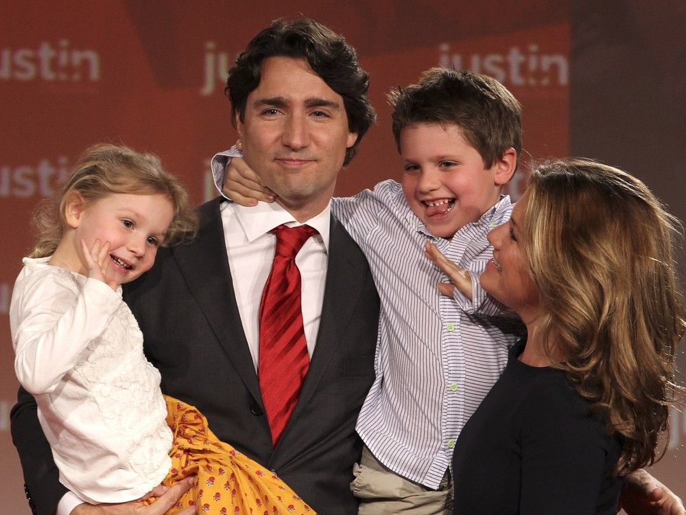   Justin Trudeau holds his two children, Xavier and Ella-Grace, as they wave to the crowd as Sophie Grégoire Trudeau looks on in Ottawa, April 14, 2013.