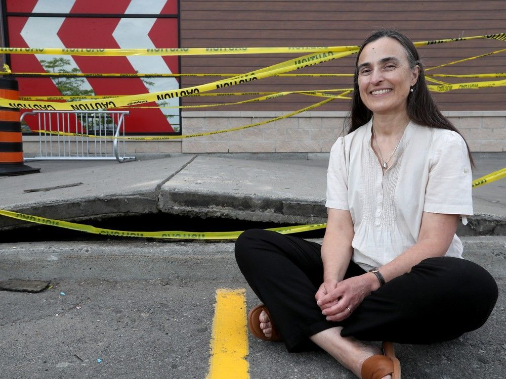 Beatriz Martin-Perez, a civil engineering professor at the University of Ottawa, explains how heat affects concrete like this heaved sidewalk in front of the Goodlife Fitness at Herongate Mall. Beatriz Martin-Perez, a civil engineering professor at the University of Ottawa, explains how heat affects concrete like this heaved sidewalk in front of the Goodlife Fitness at Herongate Mall.