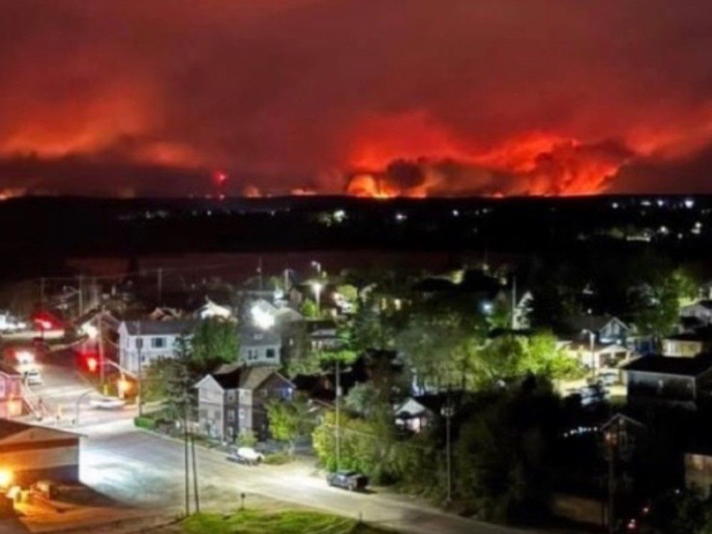 NextImg:Manitoba: Cool temperatures, chance of rain as crews battle wildfires near Flin Flon