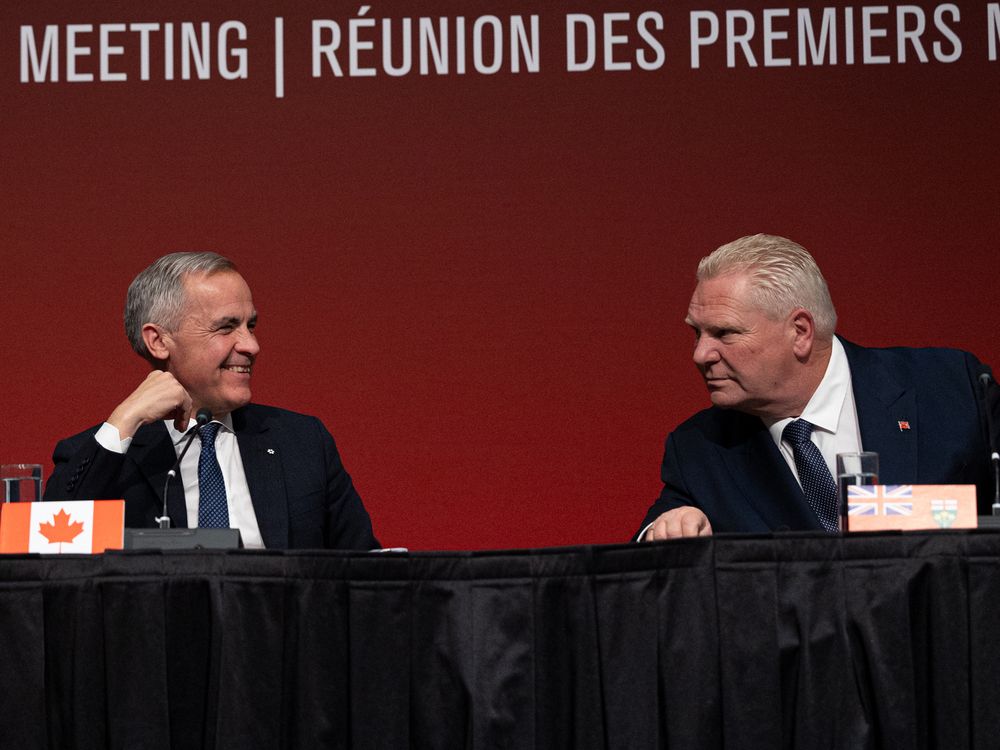 Prime Minister Mark Carney and Ontario Premier Doug Ford speak during a press conference after the first ministers’ meeting at TCU Place in Saskatoon on June 2, 2025. 