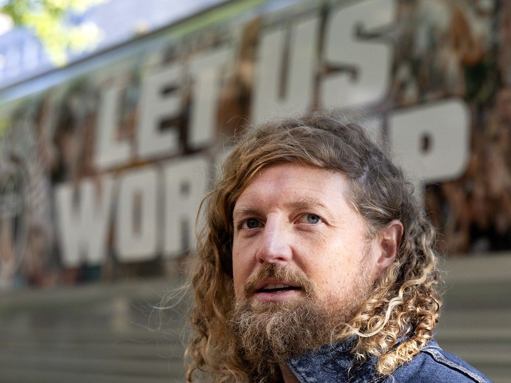  U.S. Christian singer Sean Feucht speaks to reporters before his worship concert at a Montreal church on Friday.