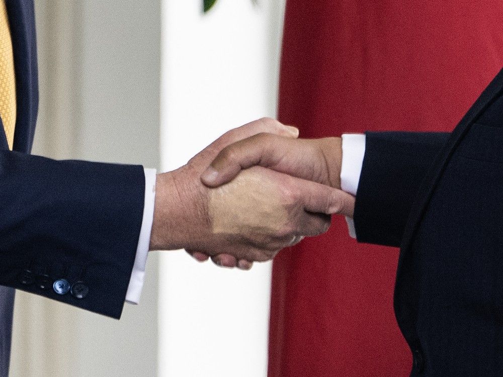  Discolouration is seen on the hand of U.S. President Donald Trump as he welcomes Bahrain’s Crown Prince Salman bin Hamad al-Khalifa to the White House at the West Wing entrance in Washington, DC, on July 16, 2025.