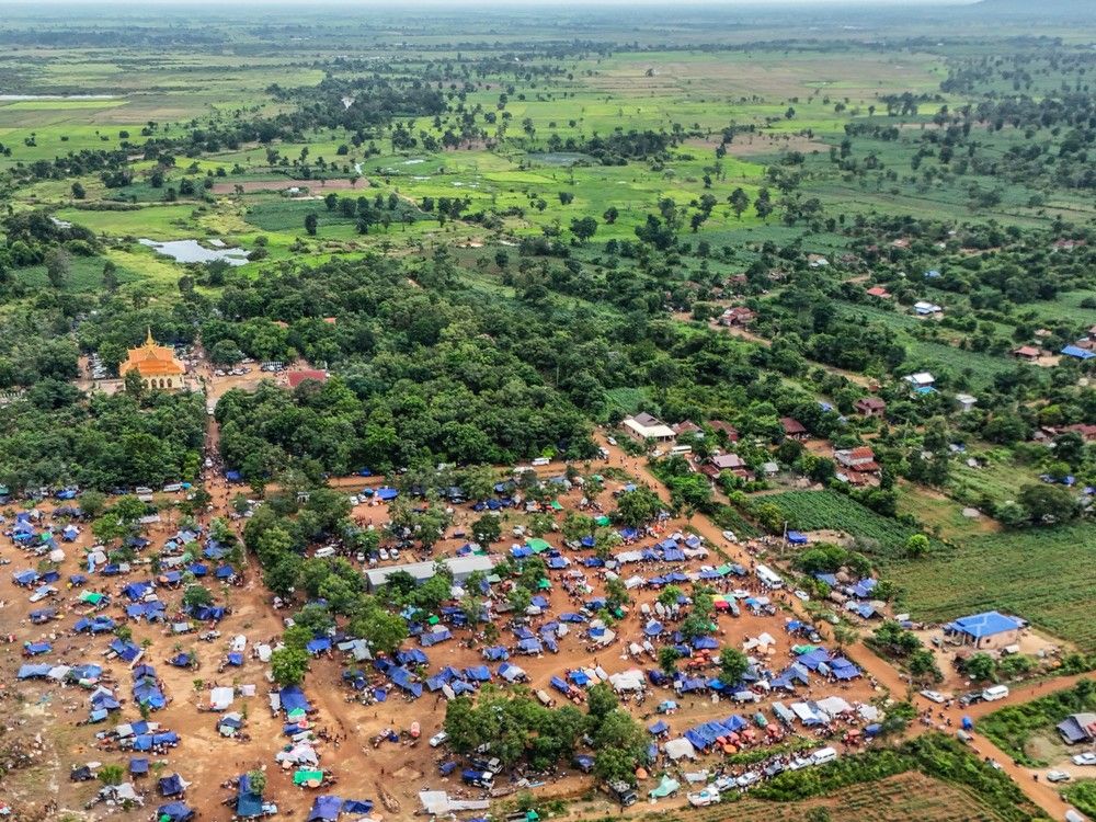  An aerial view shows people, who fled their homes near the border area between Cambodia and Thailand, taking shelter near a pagoda in Oddar Meanchey province on July 26, 2025. Thailand and Cambodia clashed for a third day, as the death toll from their bloodiest fighting in years rose to 33 and Phnom Penh called for an “immediate ceasefire”.